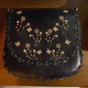 Black hand tooled leather purse with butterflies and flowers